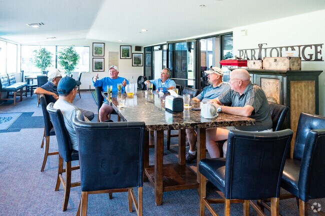 Cypress Lakes Golf Course players enjoy a conversation at the Par Lounge.