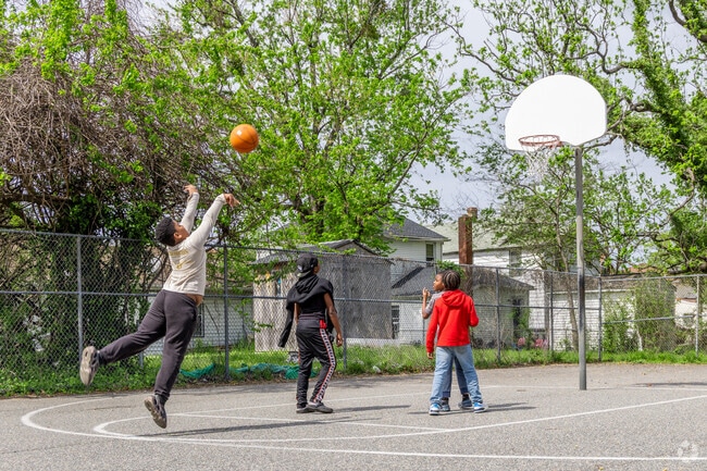 Neighborhood kids run, shoot, and make memories at 29th Street & Oak Mini Park.