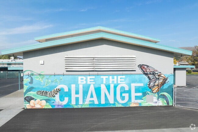 Cesar Chavez Middle School in Hayward has some great murals on the building.
