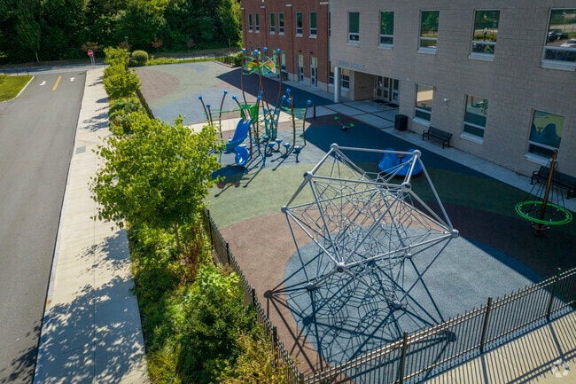 Young students love the playground behind the Caleb Dustin Hunking School.