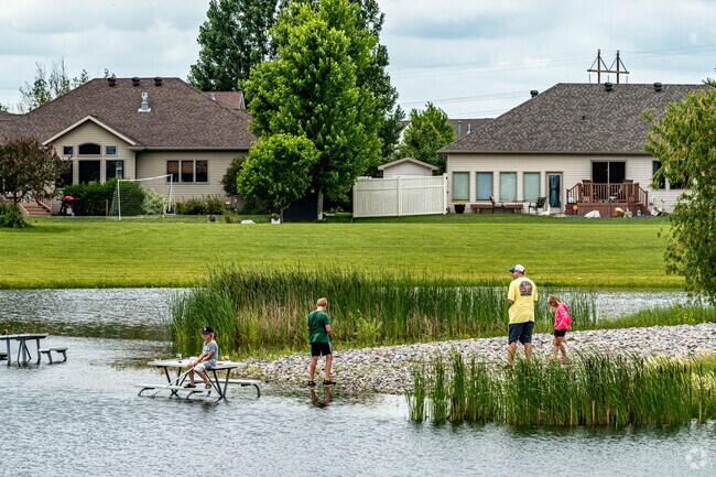 Woodhaven residents enjoy a day outside at the Woodhaven South Park & Fishing Pond.