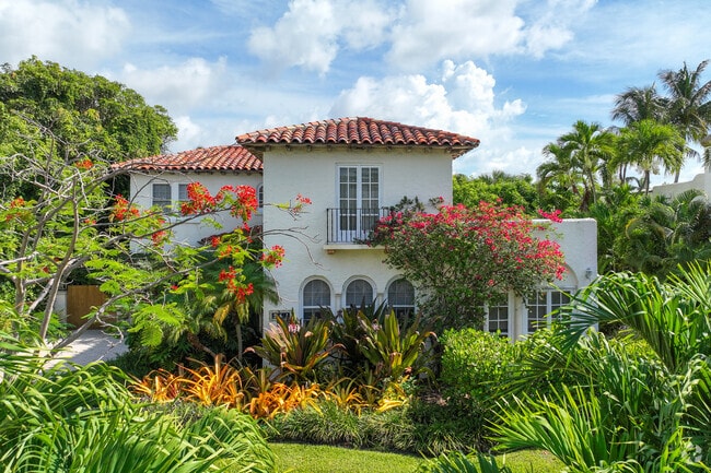 Mediterranean revival single family home with beautiful garden in El Cid neighborhood.