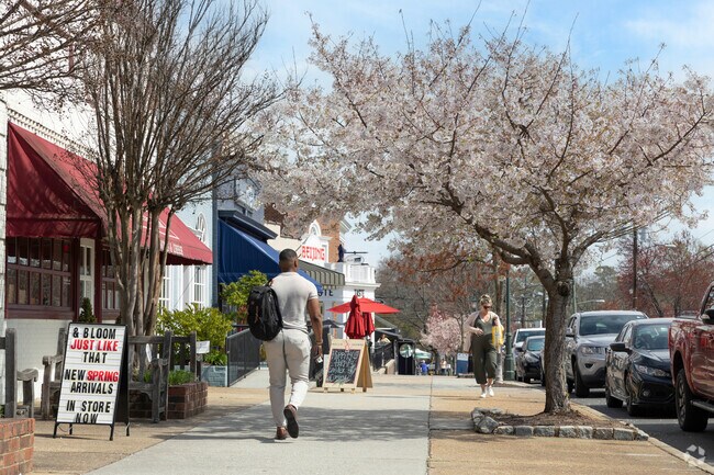 Westhampton locals stroll along Grove Avenue, exploring its charming boutiques and cafés.