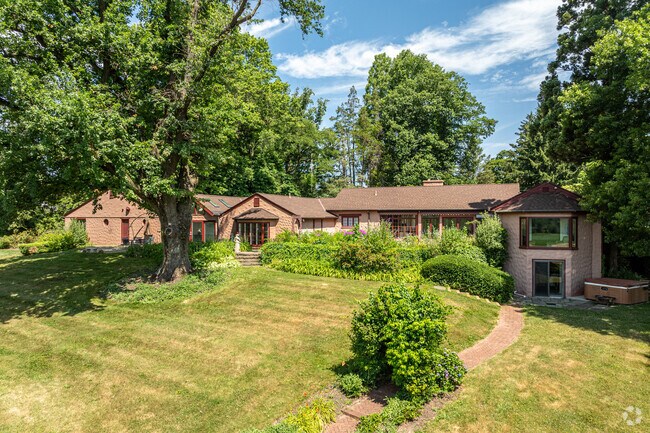Many North Coventry homes such as this rambling ranch sit on lots of several acres.