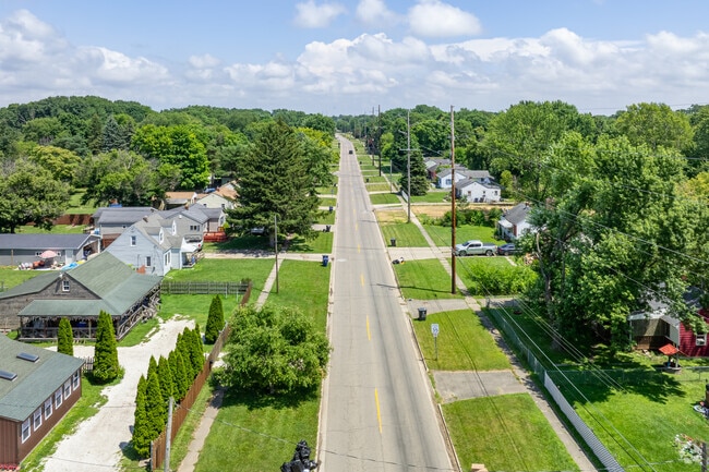 Main roads in Potter Longway feature well-maintained sidewalks set back from the road.