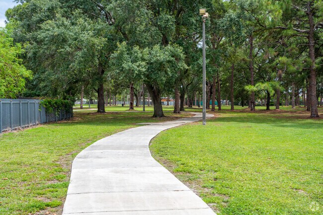Walk your furry friends along the walking paths in Vista Verde Park.