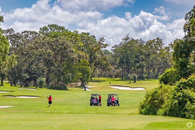 Enjoy golf on the beautiful Sugarmill Country Club course in Oak Village at Sugarmill Woods.