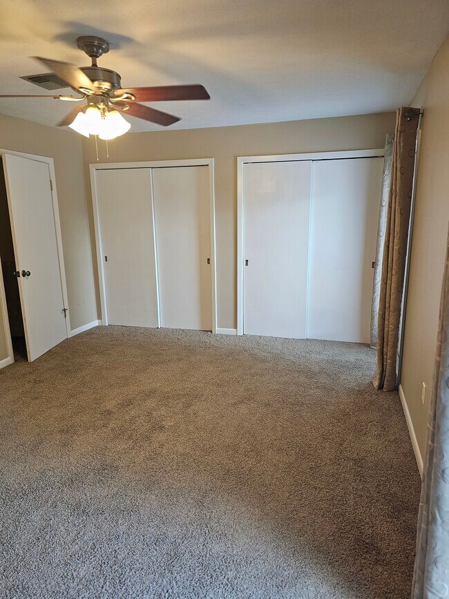 Primary bedroom view towards closets