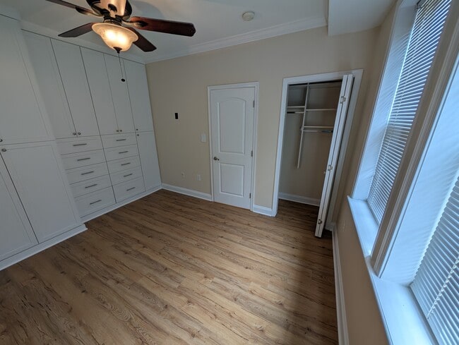 Master bedroom with built-in closet wall