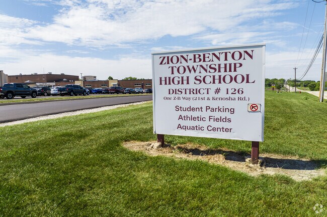 Zion-Benton Township High School focuses on student athletics featuring a large football field.