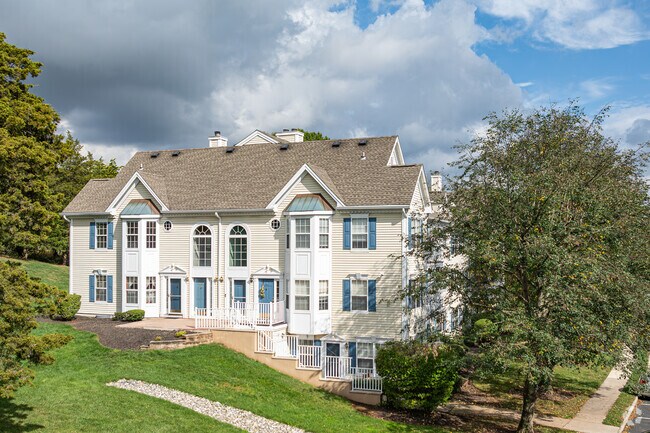 Townhomes are nestled among the trees along the hillsides of Branchburg.