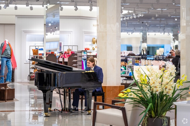 Shoppers can browse items to the background sounds of live piano at the West Towne Mall near Prairie Hills.