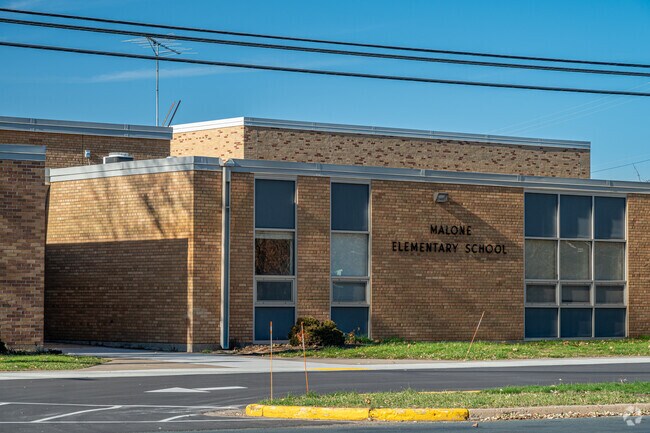 The main entrance for Malone Elementary School faces east.