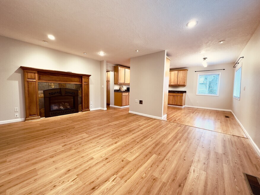 View of living room, dining room, and kitchen