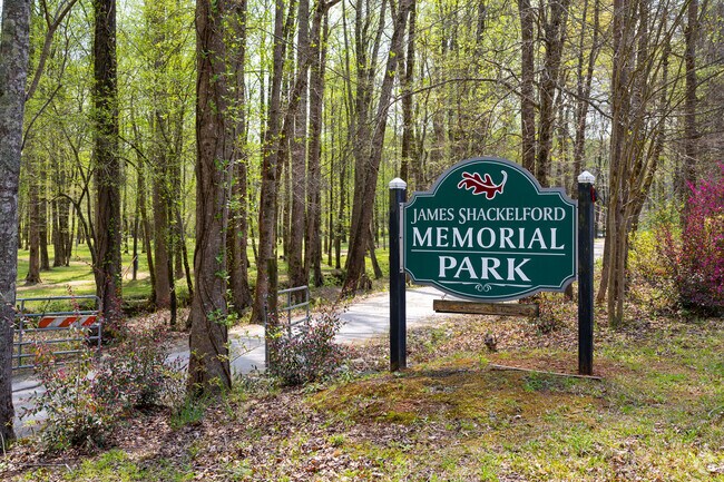 James Shackelford Park is a beautiful, vibrant oasis nestled in Auburn, featuring a network of winding walking trails that meander through lush greenery and colorful flower beds.