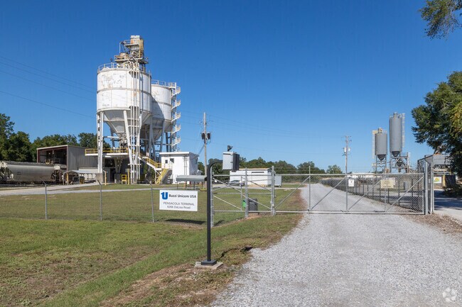 A freight railroad and industrial facilities sit on Bagdad’s outskirts.