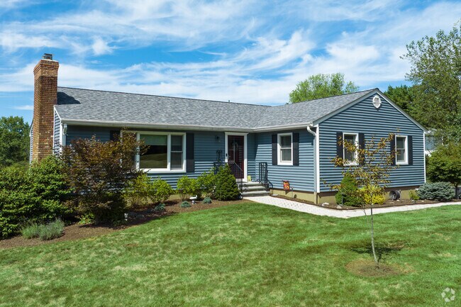 Well-kept lawns frame ranch-style homes along quiet streets in Bedminster.