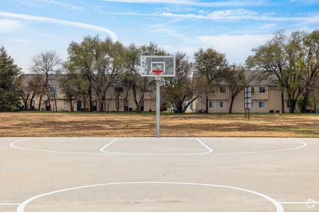 There is a basketball court in Harrison Park.