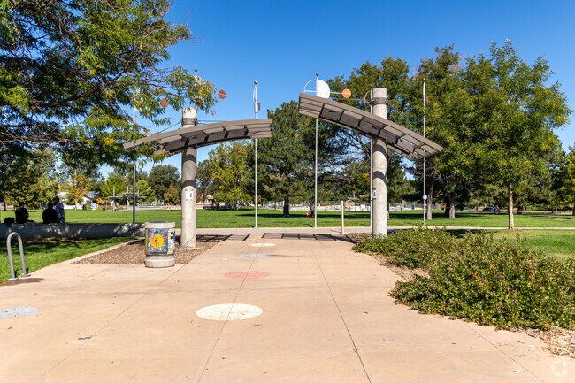 Aurora City Park features a circular lawn and colorful playscape in North Aurora.