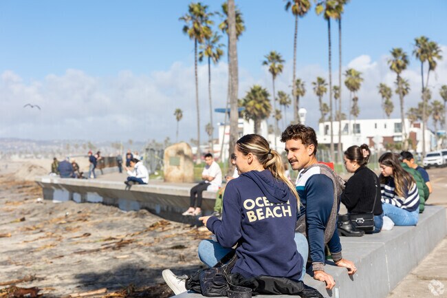 A couple enjoys ocean views at Ocean Beach located near Point Loma Heights.