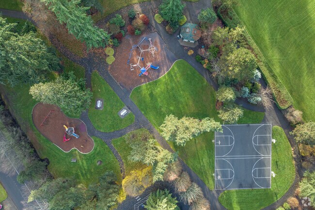 Lake Hills Park features grassy fields along with a playground and basketball court.