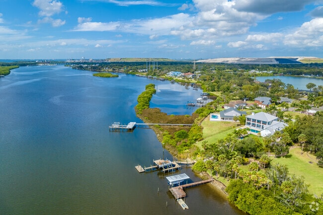 Waterfront homes in Progress Village sit along the Alafia River to the south.