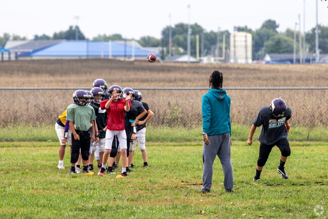A youth football team practices at Waymond Morris Park near Apollo.