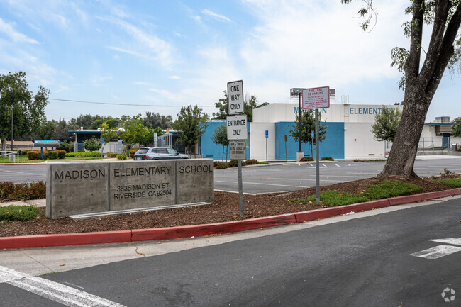 The prominent signage of Madison Elementary School is proudly displayed on Madison Street.
