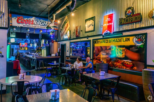 TJ’s Bar & Grill pairs sports screens with an industrial vibe.