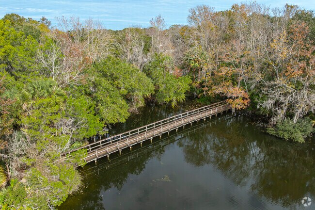 Use the bridge to traverse one of the many waterways in Central Park.