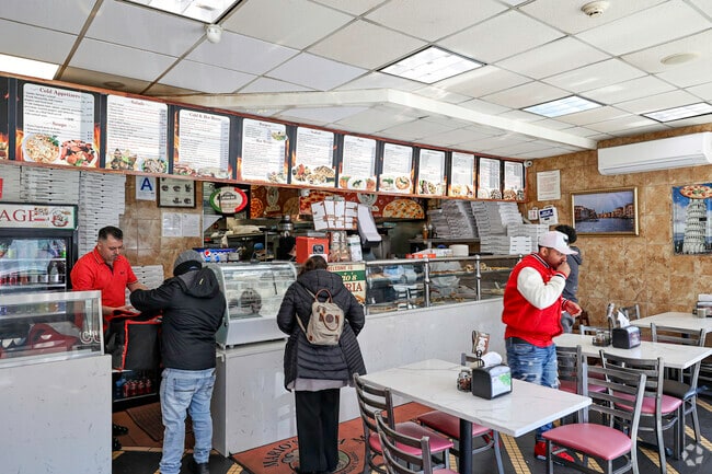 Enjoying the best pizza in the Belmont community at Mario's restaurant.