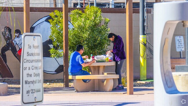 Locals unwind with a picnic at Stupak Park in Meadows Village.