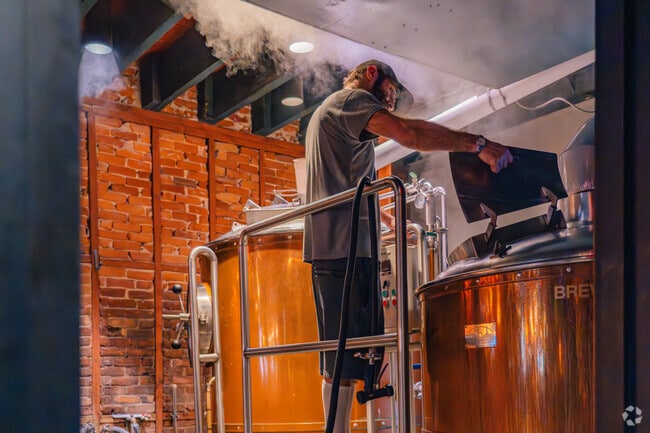 On occasion, local visitors can find artisans of Moon Hill Brewing Company tending to the tanks.