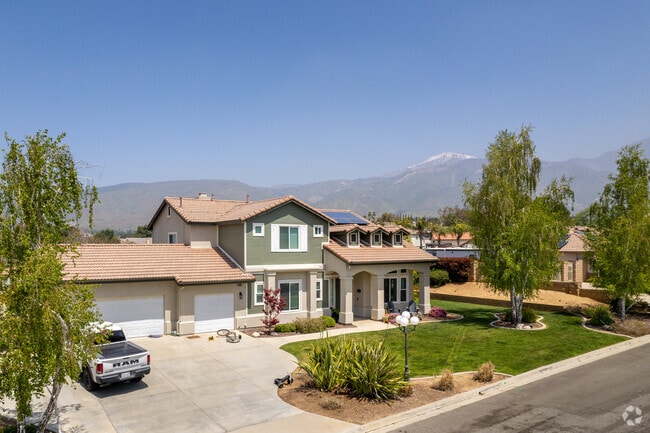 Snow caps peek from behind homes in Upper Yucaipa-Rolling Hills.
