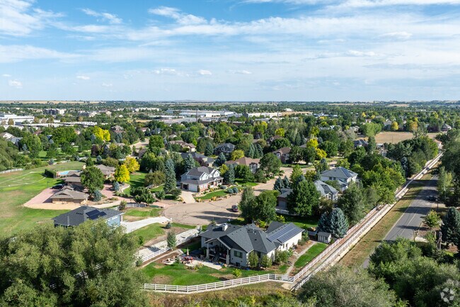 Scenic aerial view of Schlagel, where streets weave through cozy homes and green spaces.