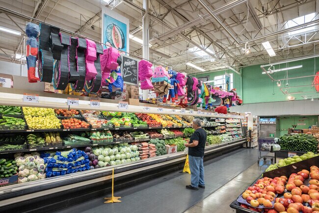 A man ponders what he wants at Rancho San Miguel in East Lodi while Piñatas hang above.