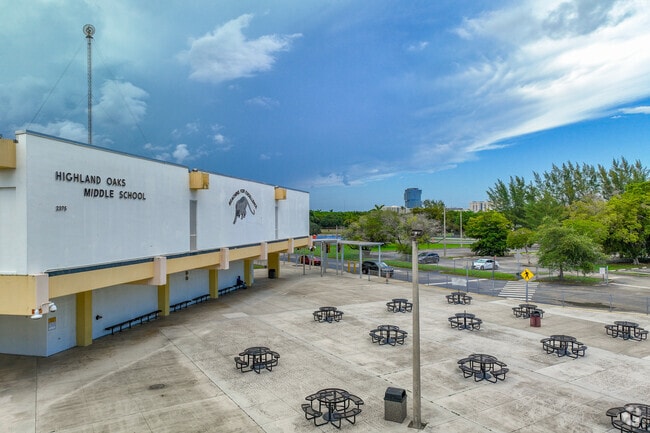 Highland Oaks Middle School has a large front yard with tables.