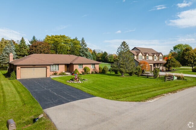 Regency homeowners enjoy spacious lawns and trees to offer some privacy.