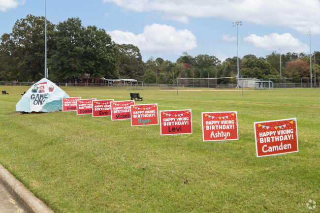 Birthday pennants and commemorative stone at Colfax Elementary School.