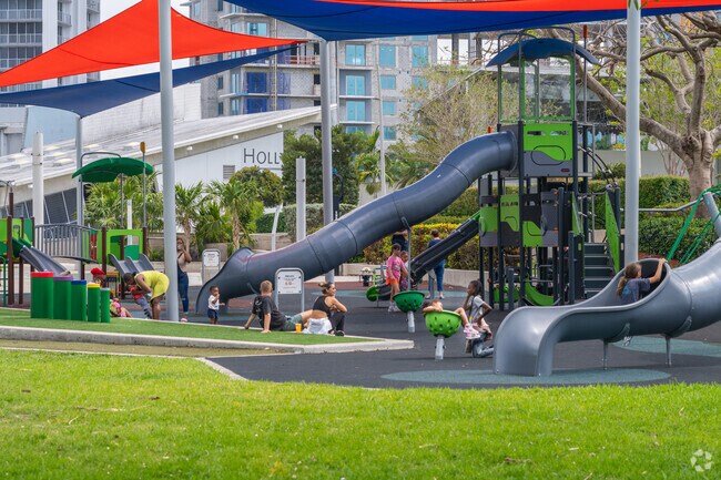 Bond with family at the playground near West Park.