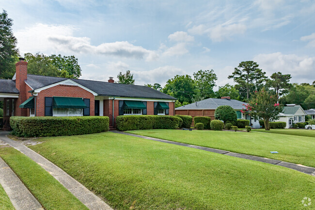 Brick ranch homes in Forest Hills North are showcased by well-manicured lawns.