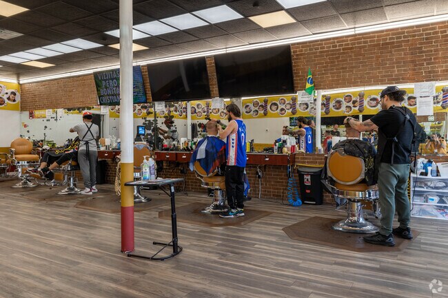 There is never a quiet moment for the barbers at Whitman Barber Shop on Washington St.