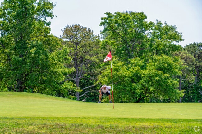 A golfer holds his breath as he watches his ball roll at Willowbend Golf Club in Mashpee Neck.