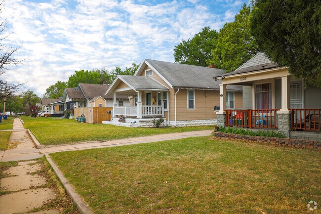 Row of homes with large front porches in The Hyde.