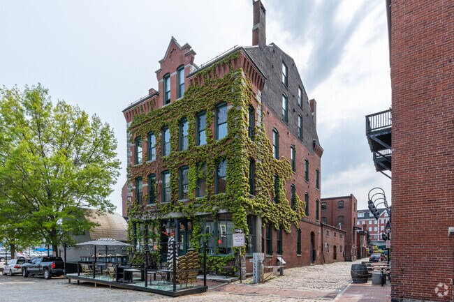 19th century buildings have homes on the upper levels and local businesses below.