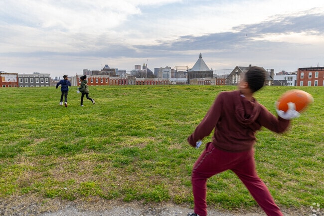 You can play catch with a scenic view of the city at the open fields in Johnston Square Park.