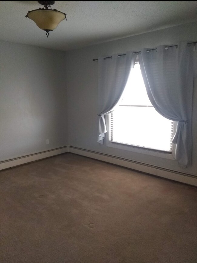 View of 1st bedroom from doorway