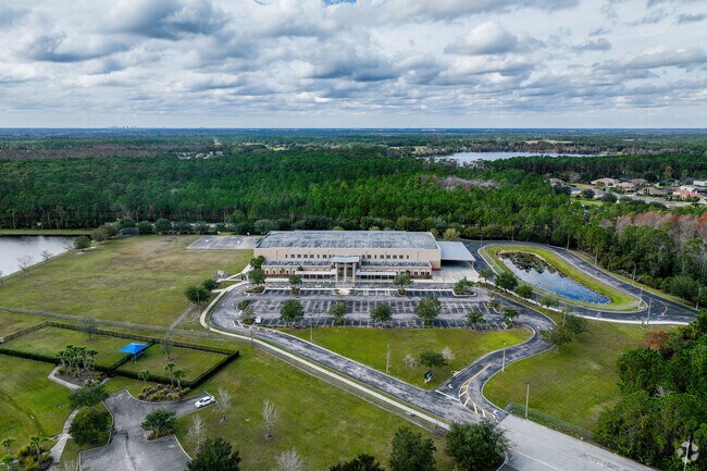 Mature trees offer privacy for kids playing on Columbia Elementary School's west side.