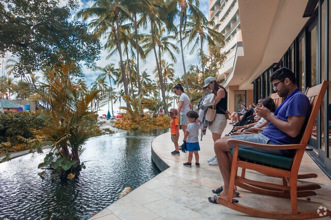 Vacationers enjoy a peaceful scene at a Waikiki resort.