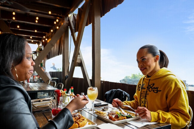 Guests at Monica's in Livermore indulge in brunch, enjoying a feast of flavors in a warm, frien